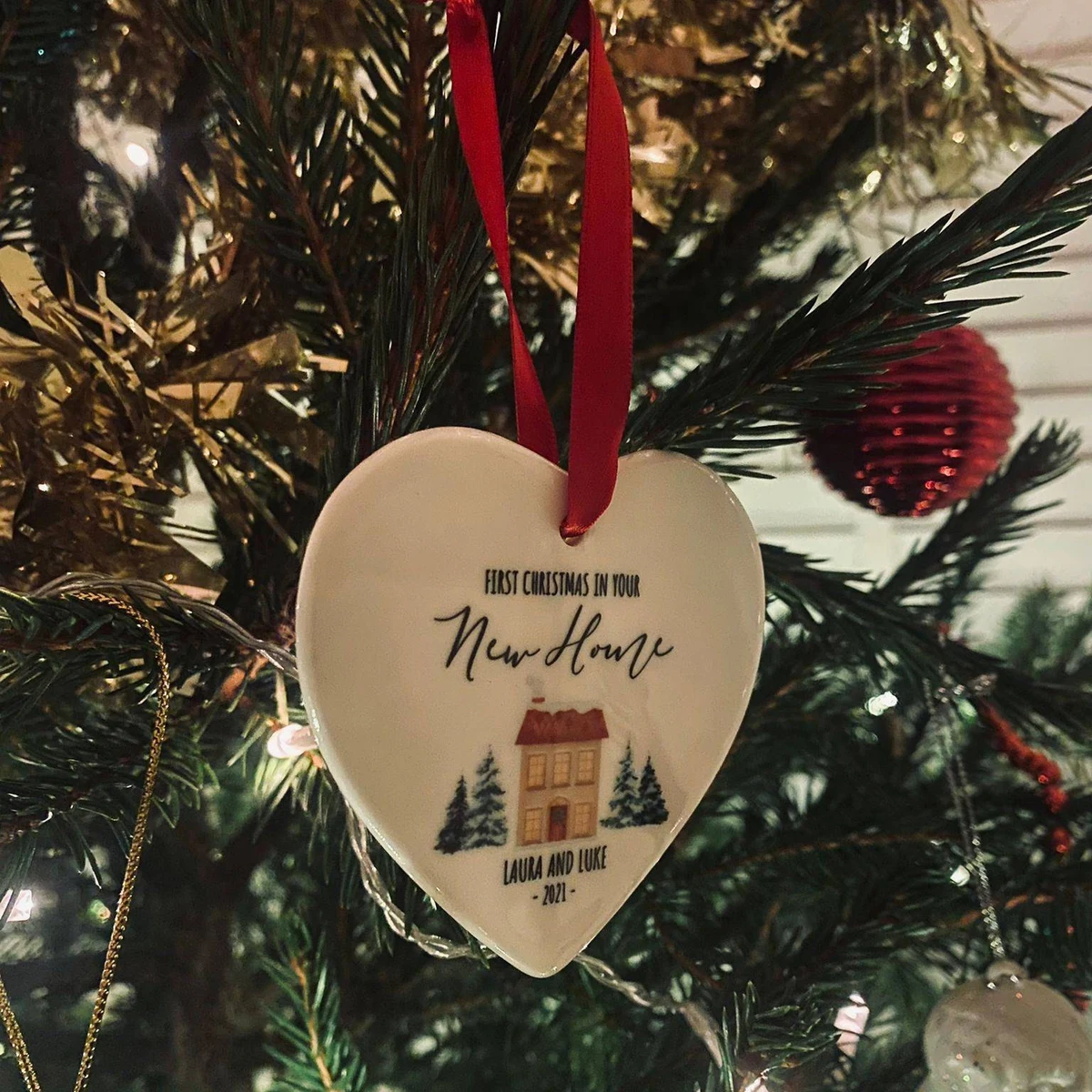 Heart-shaped 'First Christmas in your New Home' ceramic ornament for Laura and Luke 2021